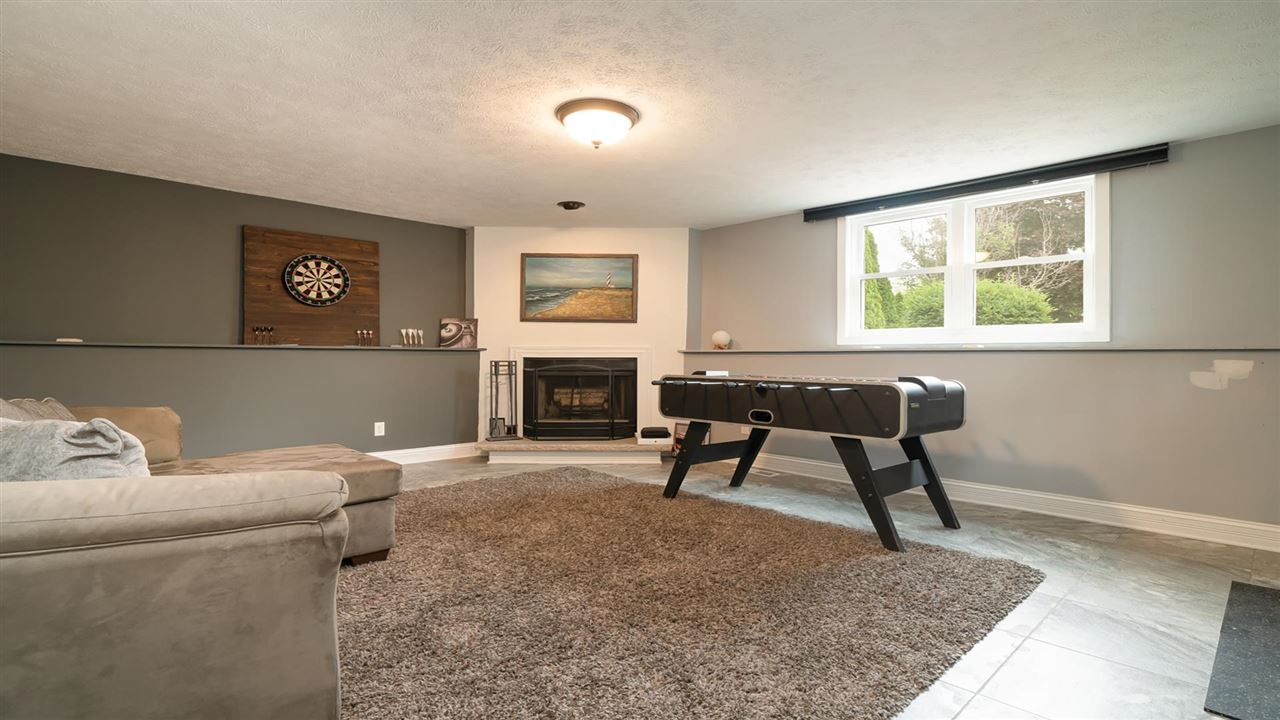 310 Pembroke Road Southwest Poplar Grove, IL 61065 - Photo 12 of 27 a living room with furniture and a fireplace