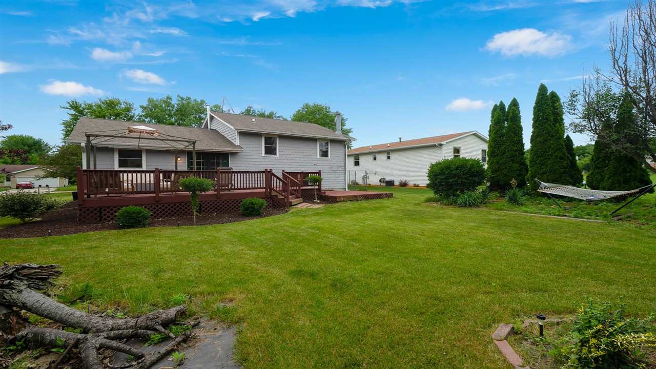310 Pembroke Road Southwest Poplar Grove, IL 61065 - Photo 25 of 27 a view of a house with a backyard and a patio