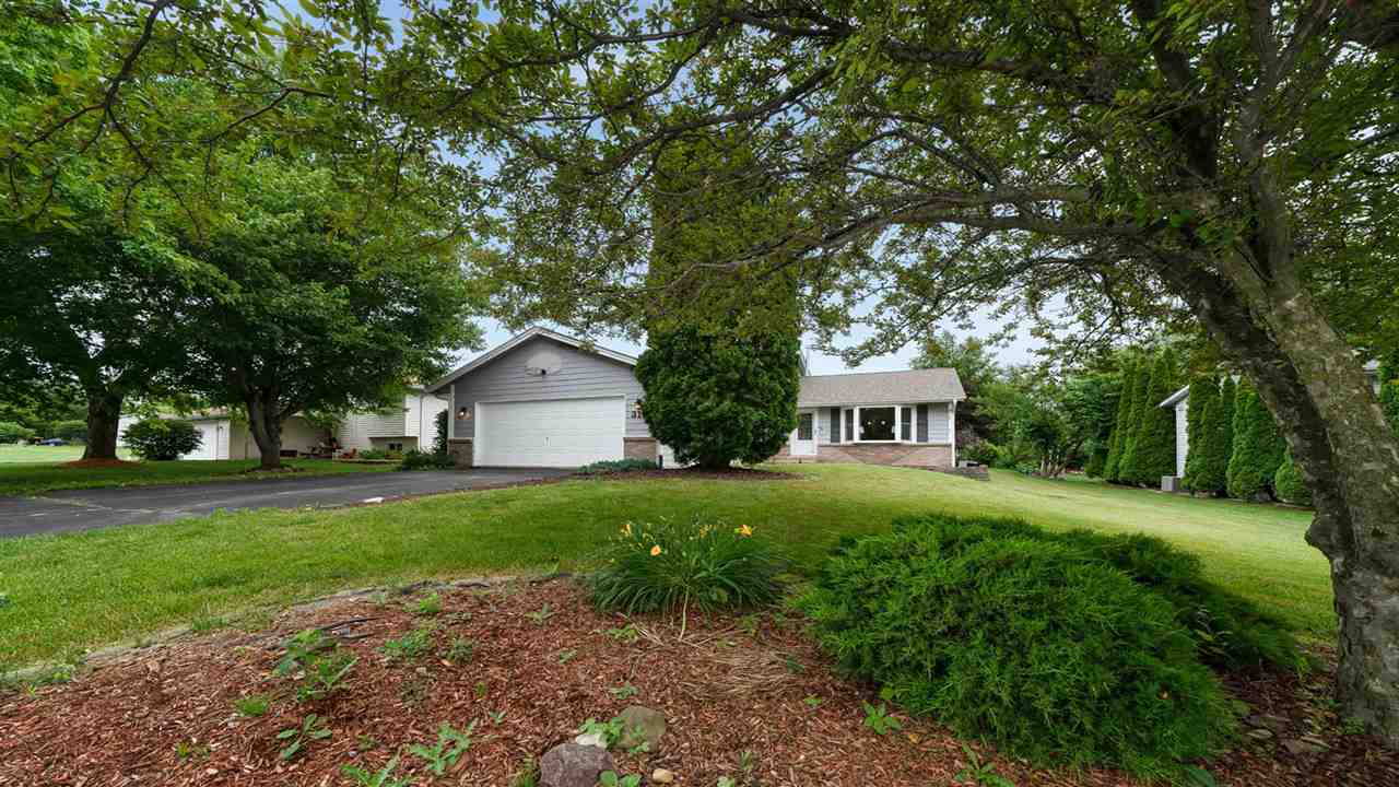 310 Pembroke Road Southwest Poplar Grove, IL 61065 - Photo 27 of 27 a front view of house with yard and green space