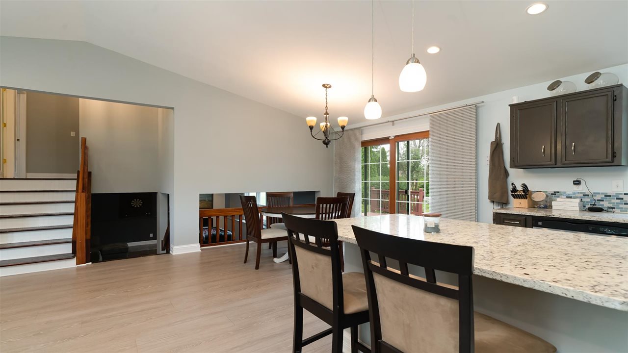 310 Pembroke Road Southwest Poplar Grove, IL 61065 - Photo 5 of 27 a view of a dining room with furniture and window
