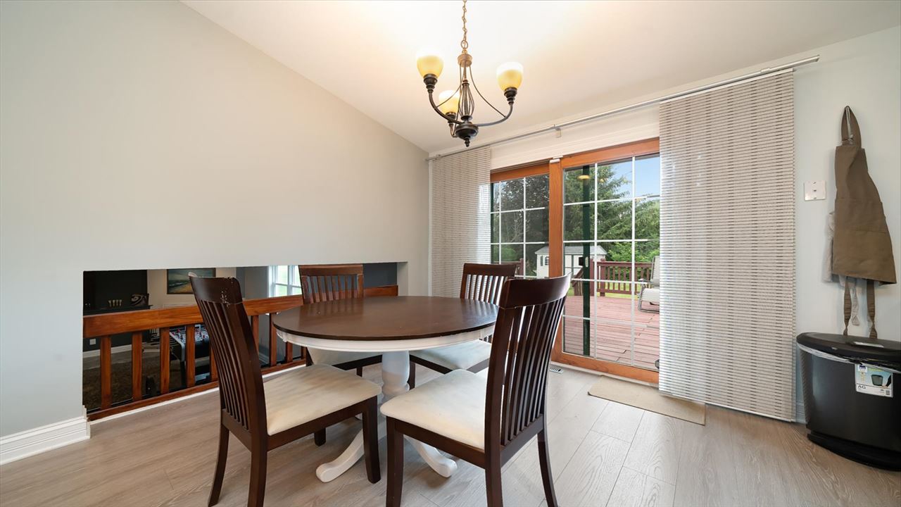 310 Pembroke Road Southwest Poplar Grove, IL 61065 - Photo 6 of 27 a view of a dining room with furniture window and wooden floor