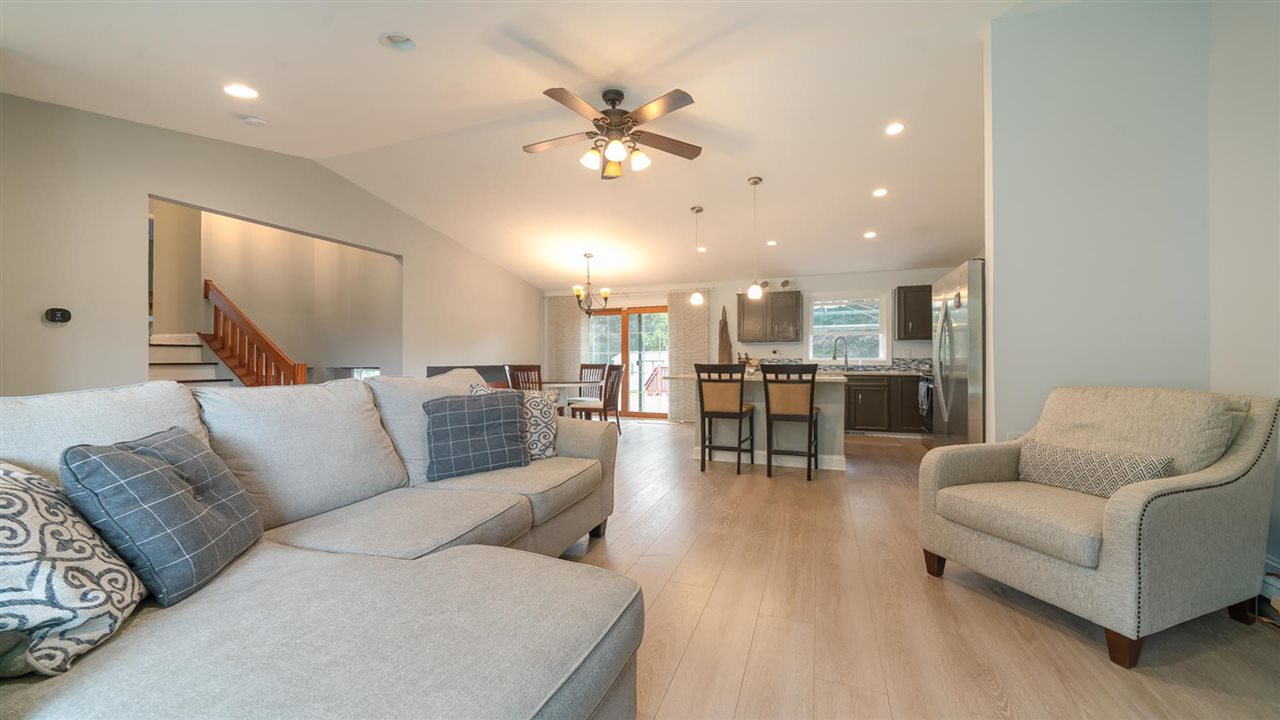 310 Pembroke Road Southwest Poplar Grove, IL 61065 - Photo 8 of 27 a living room with furniture and kitchen view
