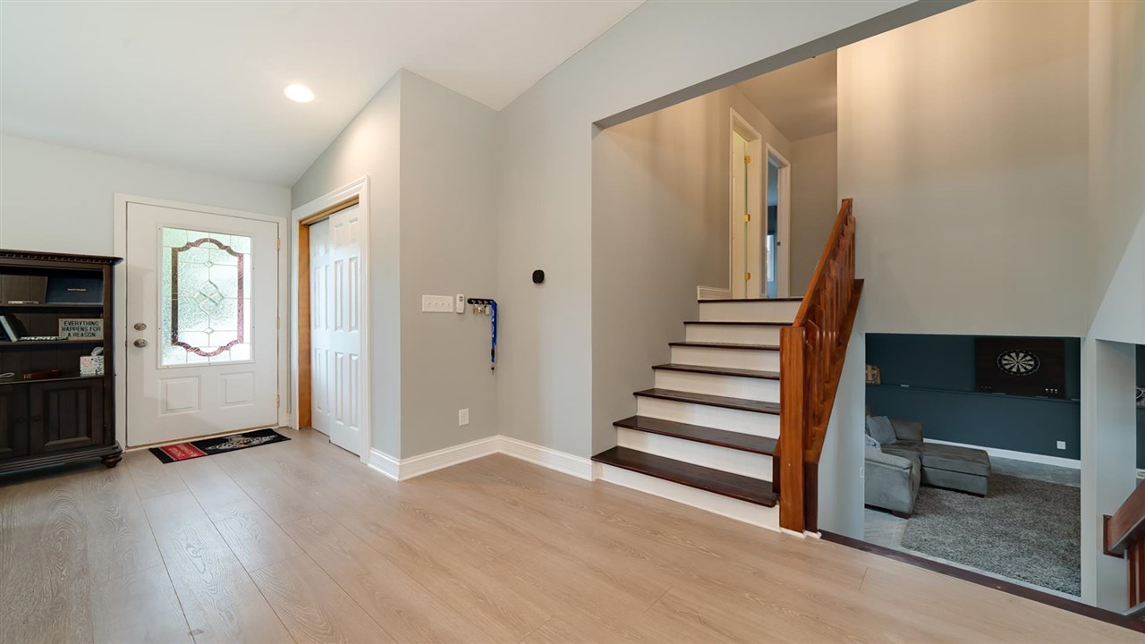 310 Pembroke Road Southwest Poplar Grove, IL 61065 - Photo 10 of 27 wooden floor in an empty room with a window