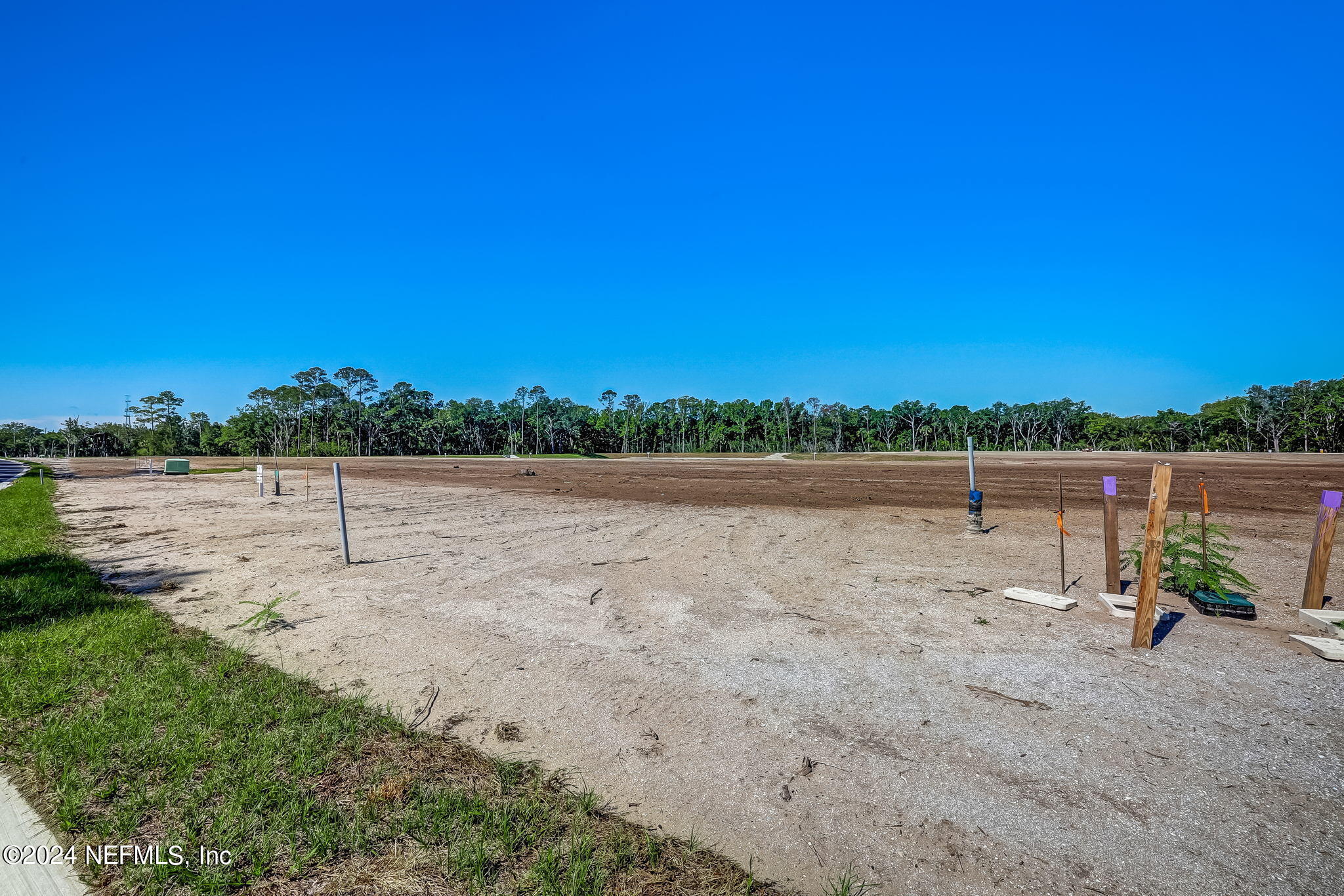 450 Shell Ridge Lane Ponte Vedra, FL 32081 - Photo 20 of 28 a view of a field with trees in the background