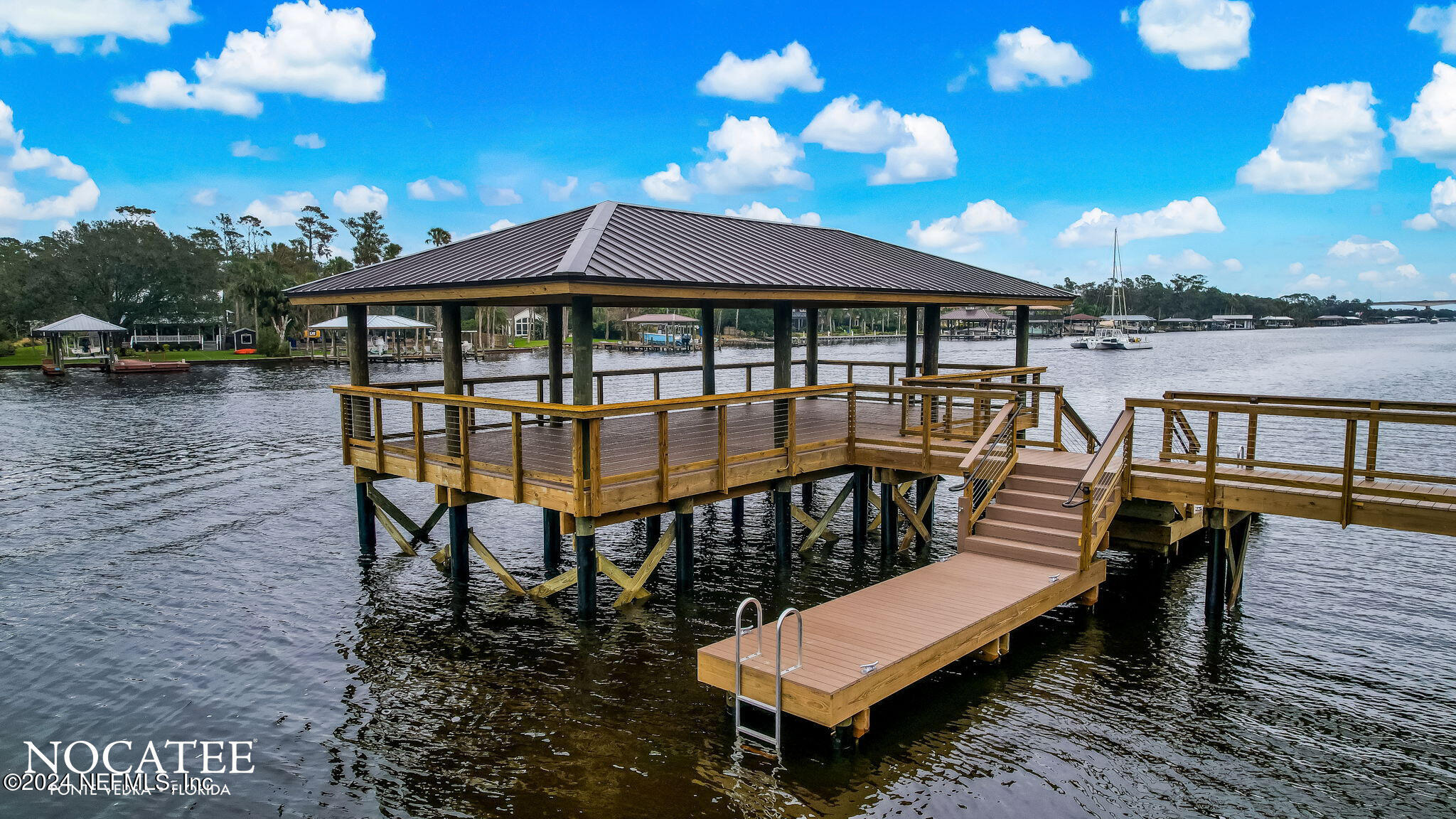 450 Shell Ridge Lane Ponte Vedra, FL 32081 - Photo 22 of 28 a view of a patio with a table and chairs
