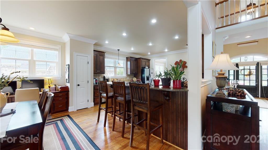 6677 Fox Ridge Circle Davidson, NC 28036 - Photo 22 of 44 a view of a dining room with furniture window and wooden floor