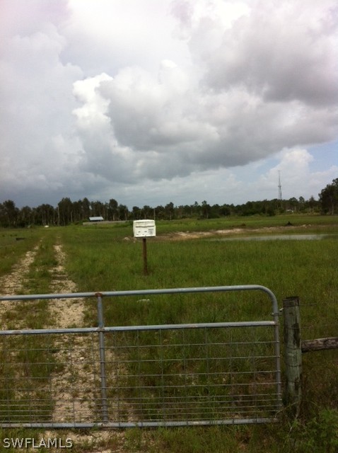 12091 Shawnee Road Fort Myers, FL 33913 - Photo 1 of 7 a view of a lake with a big yard
