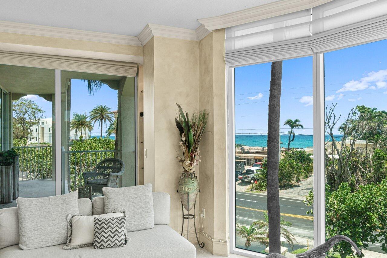 3740 South Ocean Boulevard, Unit 201 Highland Beach, FL 33487 - Photo 11 of 62 a living room with furniture and a potted plant