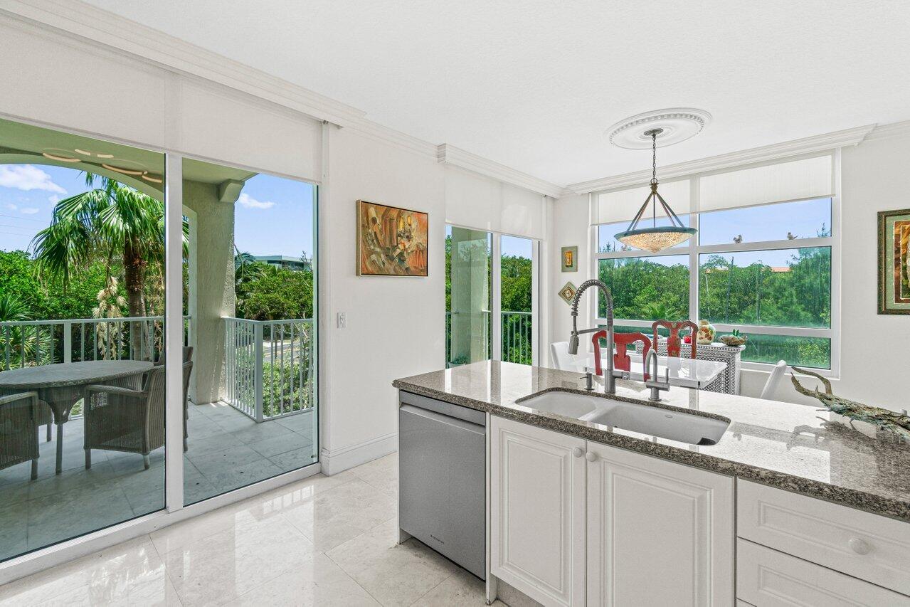 3740 South Ocean Boulevard, Unit 201 Highland Beach, FL 33487 - Photo 12 of 62 a kitchen with sink and window
