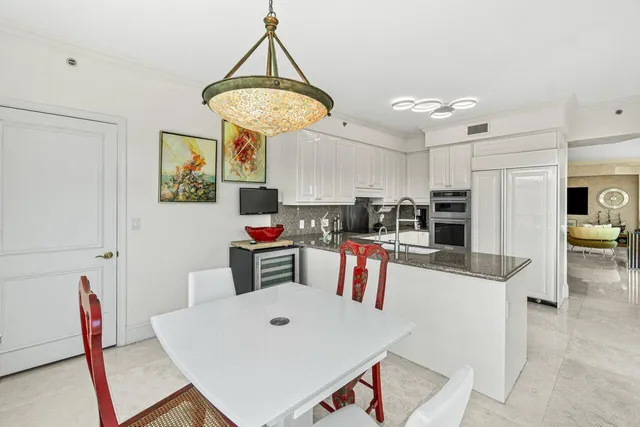 a dining room with furniture and window