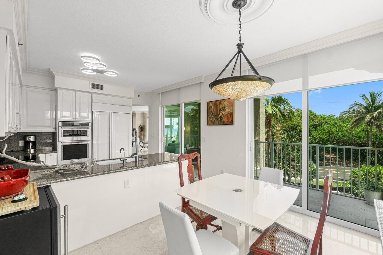 3740 South Ocean Boulevard, Unit 201 Highland Beach, FL 33487 - Photo 16 of 62 a dining room with furniture and window