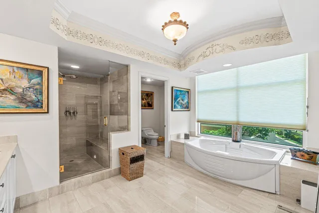 a spacious bathroom with a shower a sink and a mirror