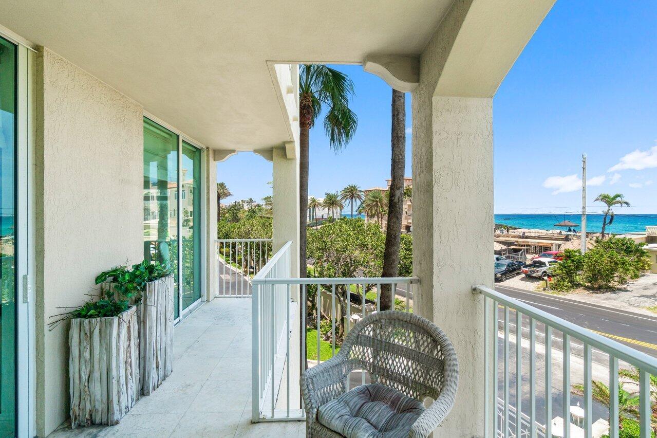 3740 South Ocean Boulevard, Unit 201 Highland Beach, FL 33487 - Photo 27 of 62 a view of a balcony and floor to ceiling window