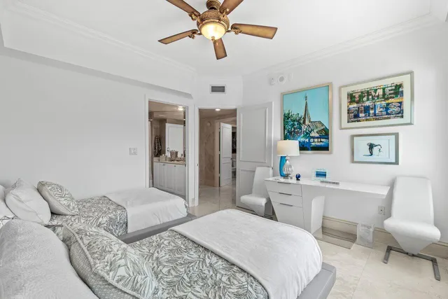 a bedroom with a bed and flat screen tv