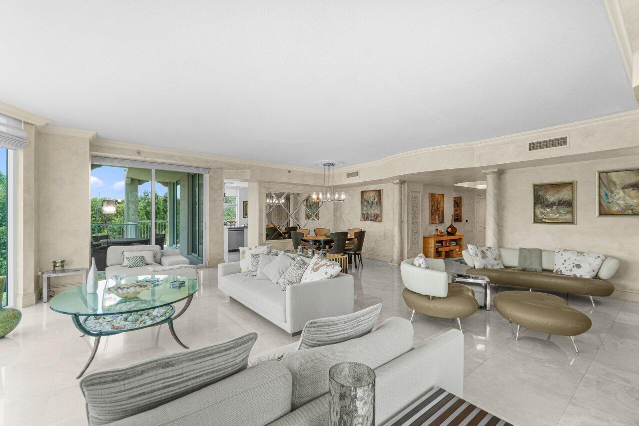 3740 South Ocean Boulevard, Unit 201 Highland Beach, FL 33487 - Photo 4 of 62 a living room with furniture and a table