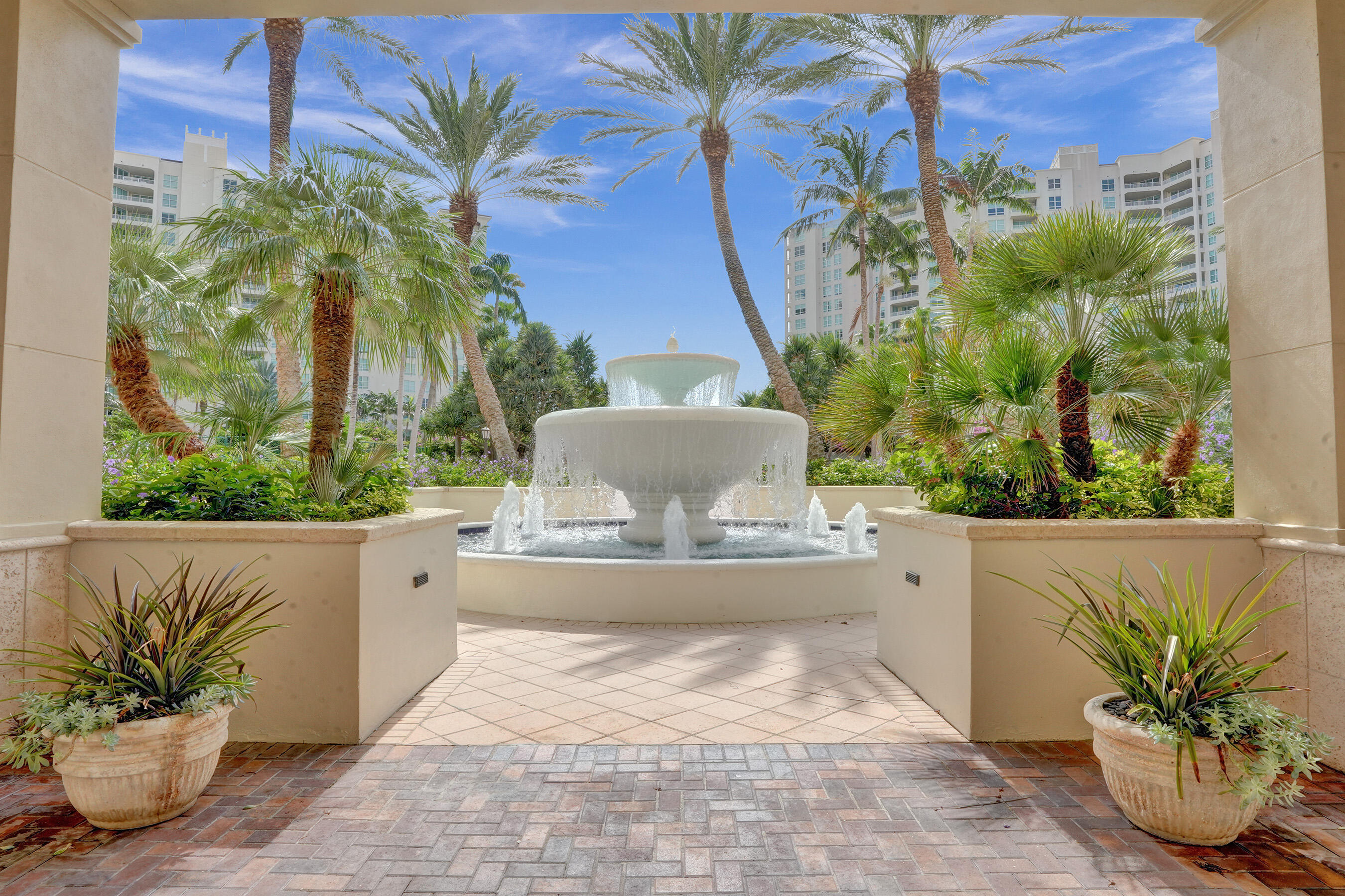 3740 South Ocean Boulevard, Unit 201 Highland Beach, FL 33487 - Photo 44 of 62 a view of a potted flower in a yard