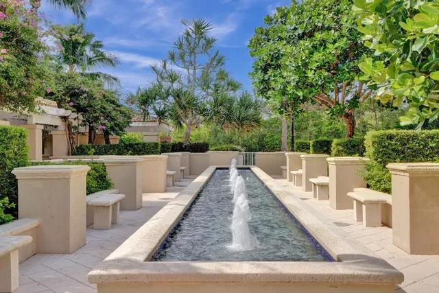 a view of a balcony with chairs and wooden floor