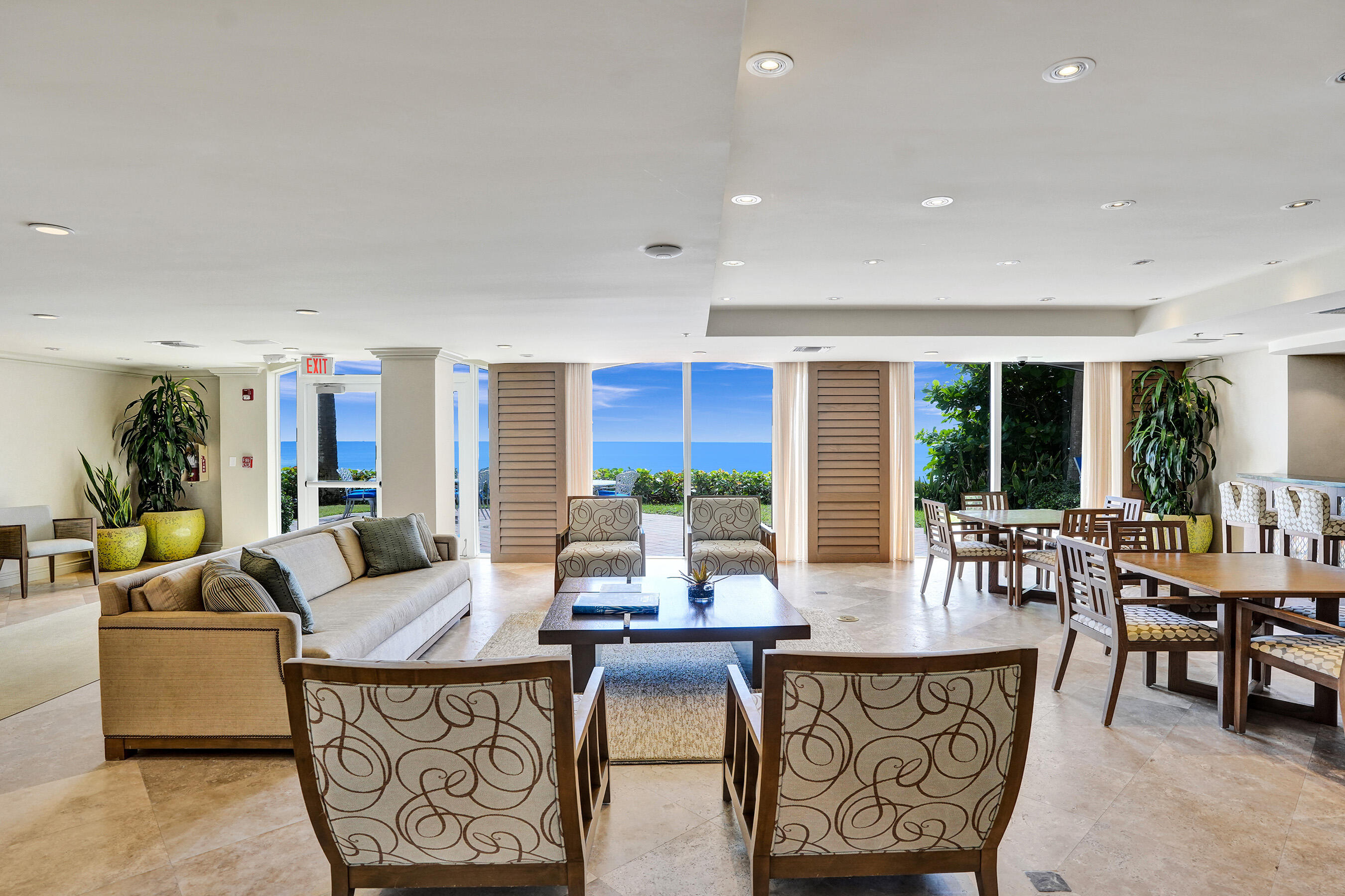 3740 South Ocean Boulevard, Unit 201 Highland Beach, FL 33487 - Photo 56 of 62 a living room with furniture a large window and a table