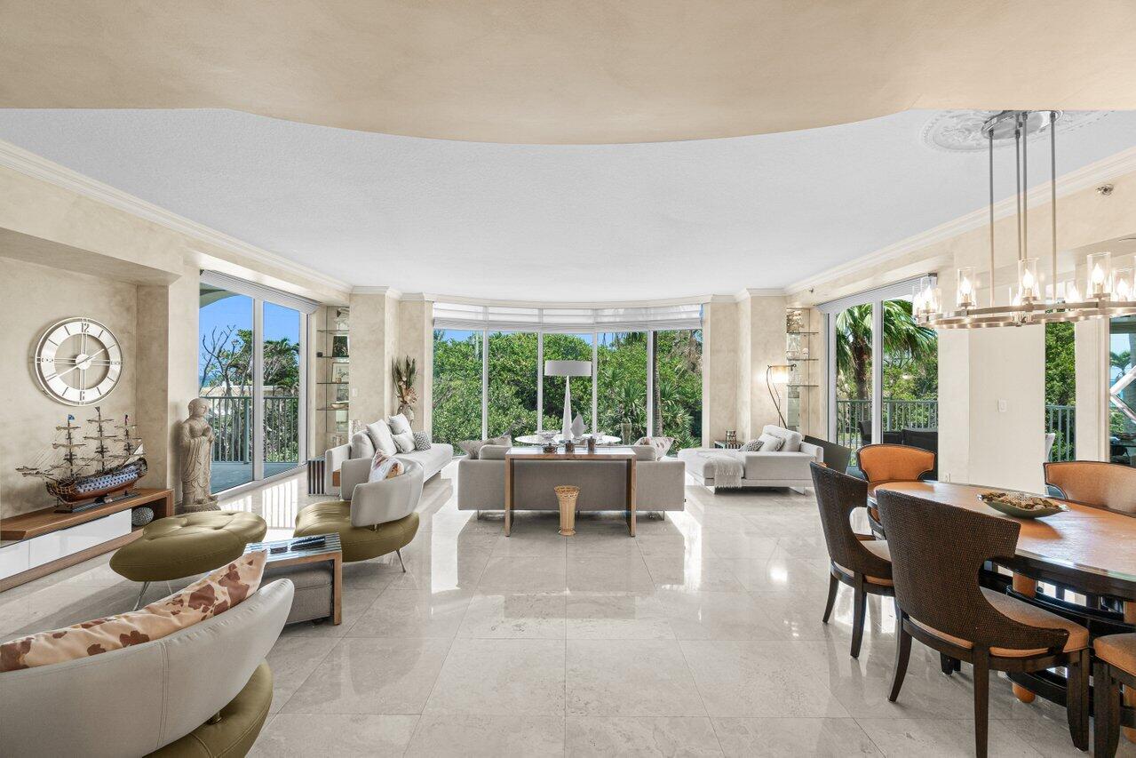 3740 South Ocean Boulevard, Unit 201 Highland Beach, FL 33487 - Photo 6 of 62 a living room with furniture and a large window