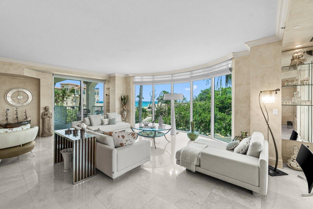 3740 South Ocean Boulevard, Unit 201 Highland Beach, FL 33487 - Photo 7 of 62 a living room with furniture and a large window