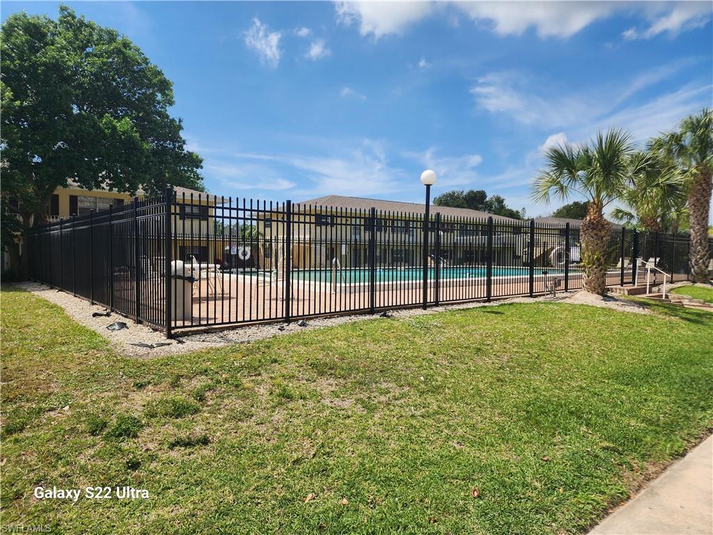 3325 Airport Road North, Unit N8 Naples, FL 34105 - Photo 20 of 22 a view of a backyard with a garden