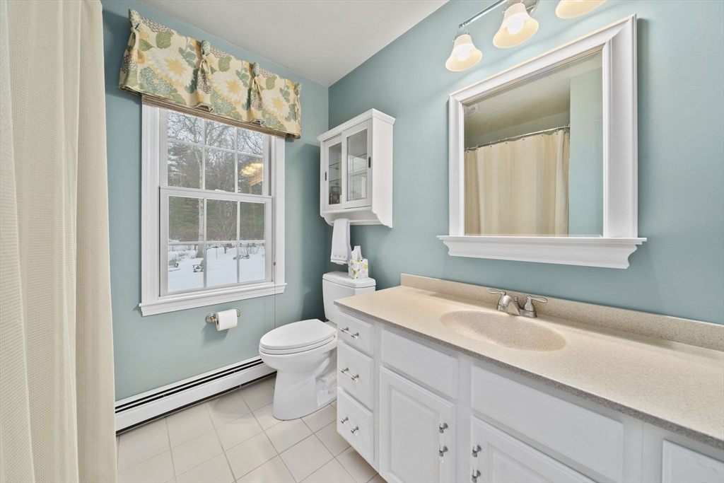86 Telegraph Hill Road Marshfield, MA 02050 - Photo 21 of 42 a bathroom with a sink toilet and mirror