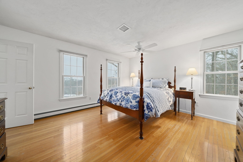 86 Telegraph Hill Road Marshfield, MA 02050 - Photo 25 of 42 a bedroom with a bed window and a table