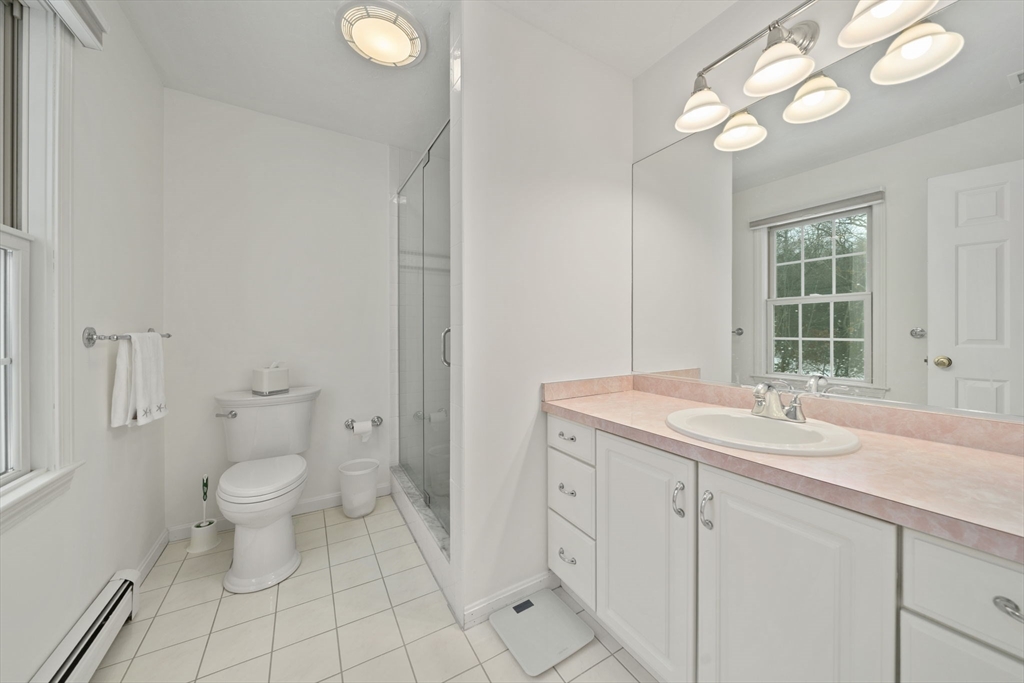 86 Telegraph Hill Road Marshfield, MA 02050 - Photo 26 of 42 a bathroom with a sink a toilet and a mirror
