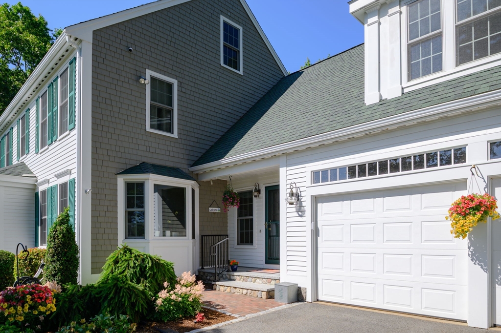 86 Telegraph Hill Road Marshfield, MA 02050 - Photo 30 of 42 a front view of a house with a garden