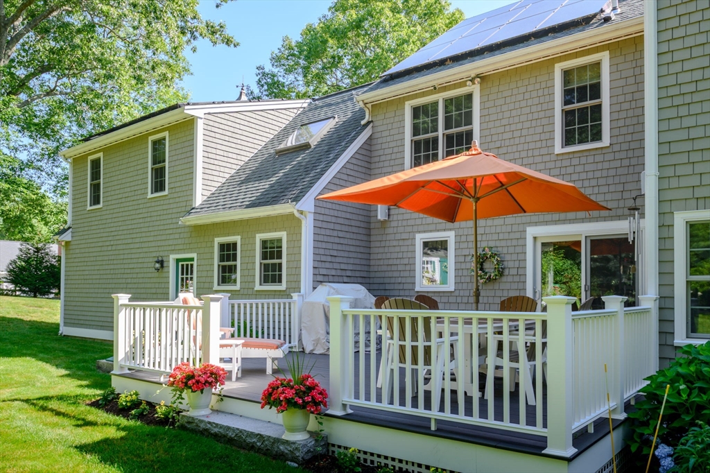 86 Telegraph Hill Road Marshfield, MA 02050 - Photo 35 of 42 a view of a house with a small yard and deck