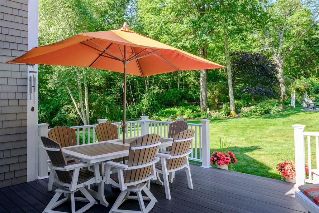 86 Telegraph Hill Road Marshfield, MA 02050 - Photo 36 of 42 a patio with a yard table and chairs