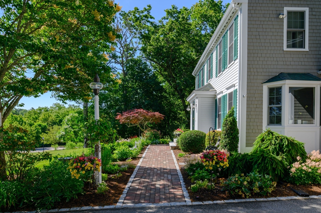 86 Telegraph Hill Road Marshfield, MA 02050 - Photo 4 of 42 a view of a garden with pathway