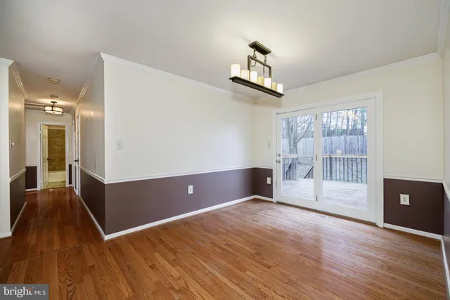 a view of livingroom with hardwood floor and a ceiling fan