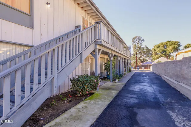 a view of a pathway with a patio