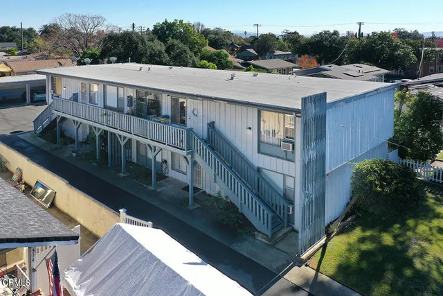 a view of a house with pool and deck