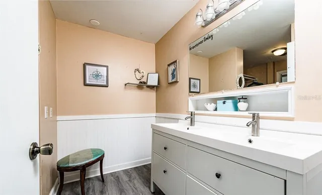 a bathroom with a sink and a mirror