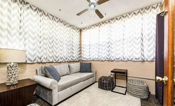 a living room with furniture and a rug