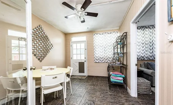 a dining room with furniture and window