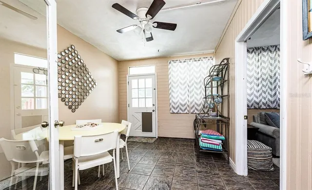 a dining room with furniture and window