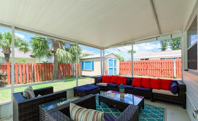 a backyard of a house with barbeque oven table and chairs