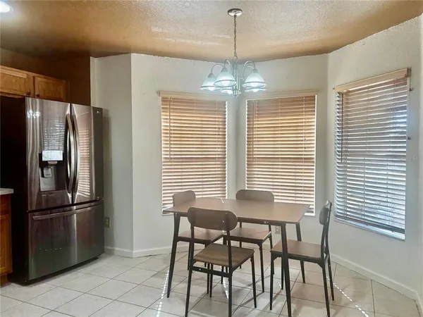 a view of a dining room with furniture window and outside view