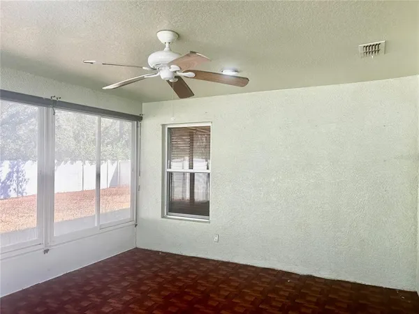 a view of an empty room with a window