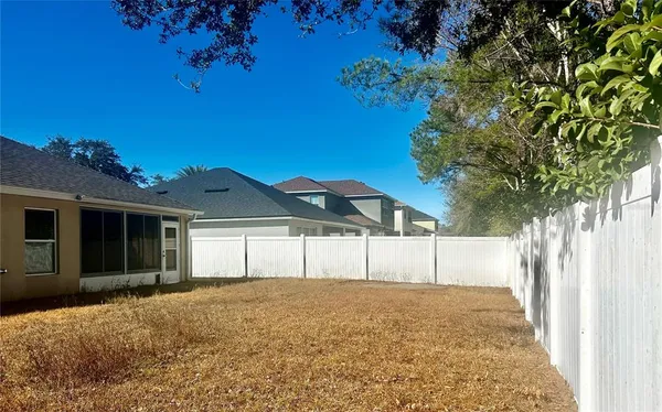 a house view with a backyard space