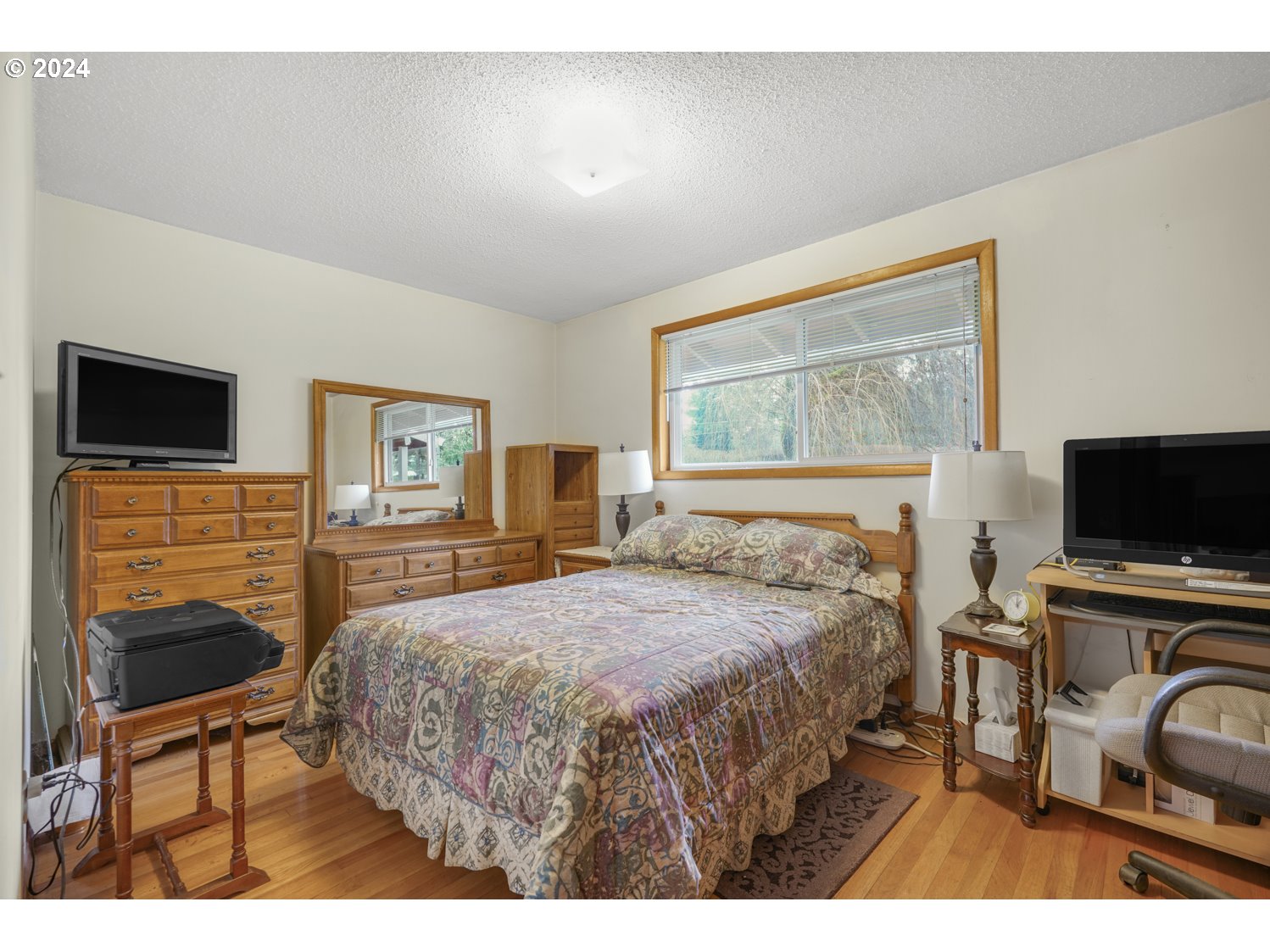 29015 Southeast Church Road Boring, OR 97009 - Photo 18 of 41 a bedroom with a bed and a flat screen tv
