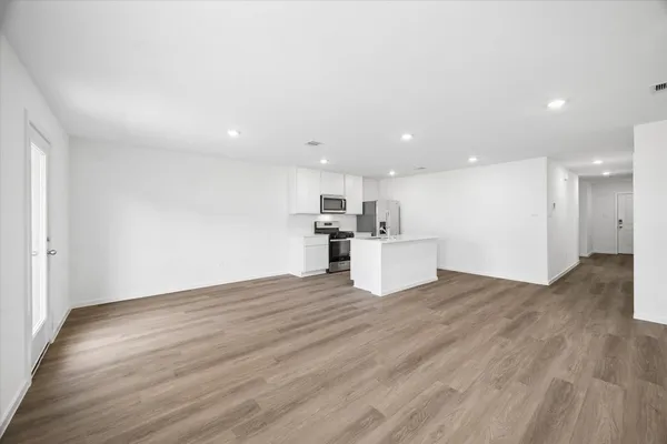 a view of kitchen with wooden floor