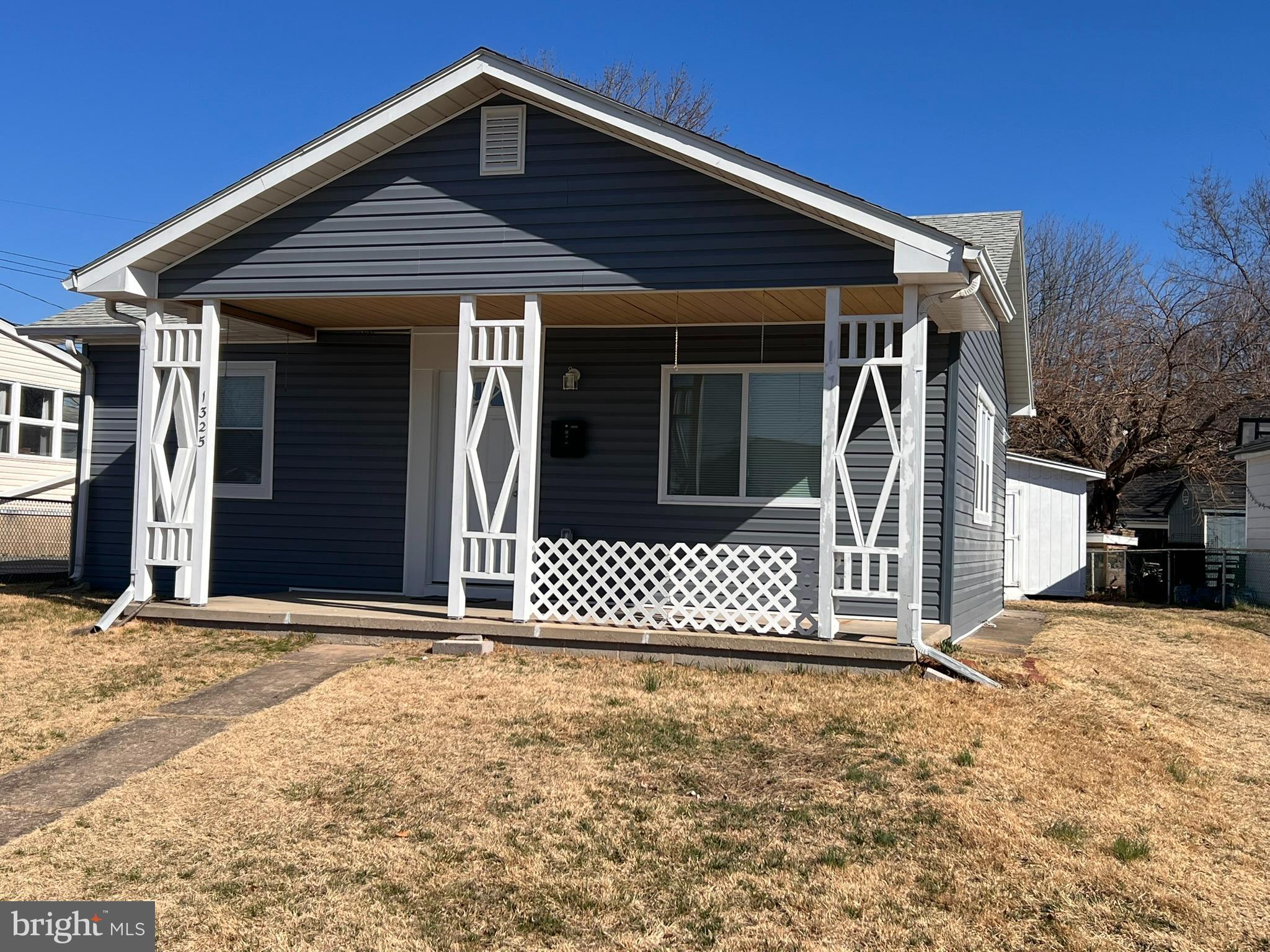 a front view of a house with a large window