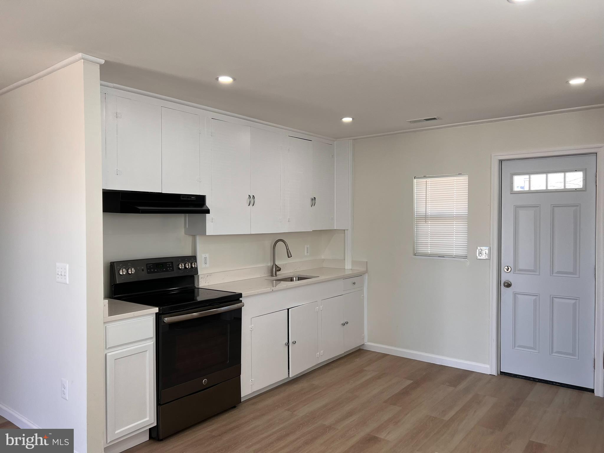 1325 Fuselage Avenue Baltimore, MD 21220 - Photo 2 of 10 a kitchen with a sink and cabinets