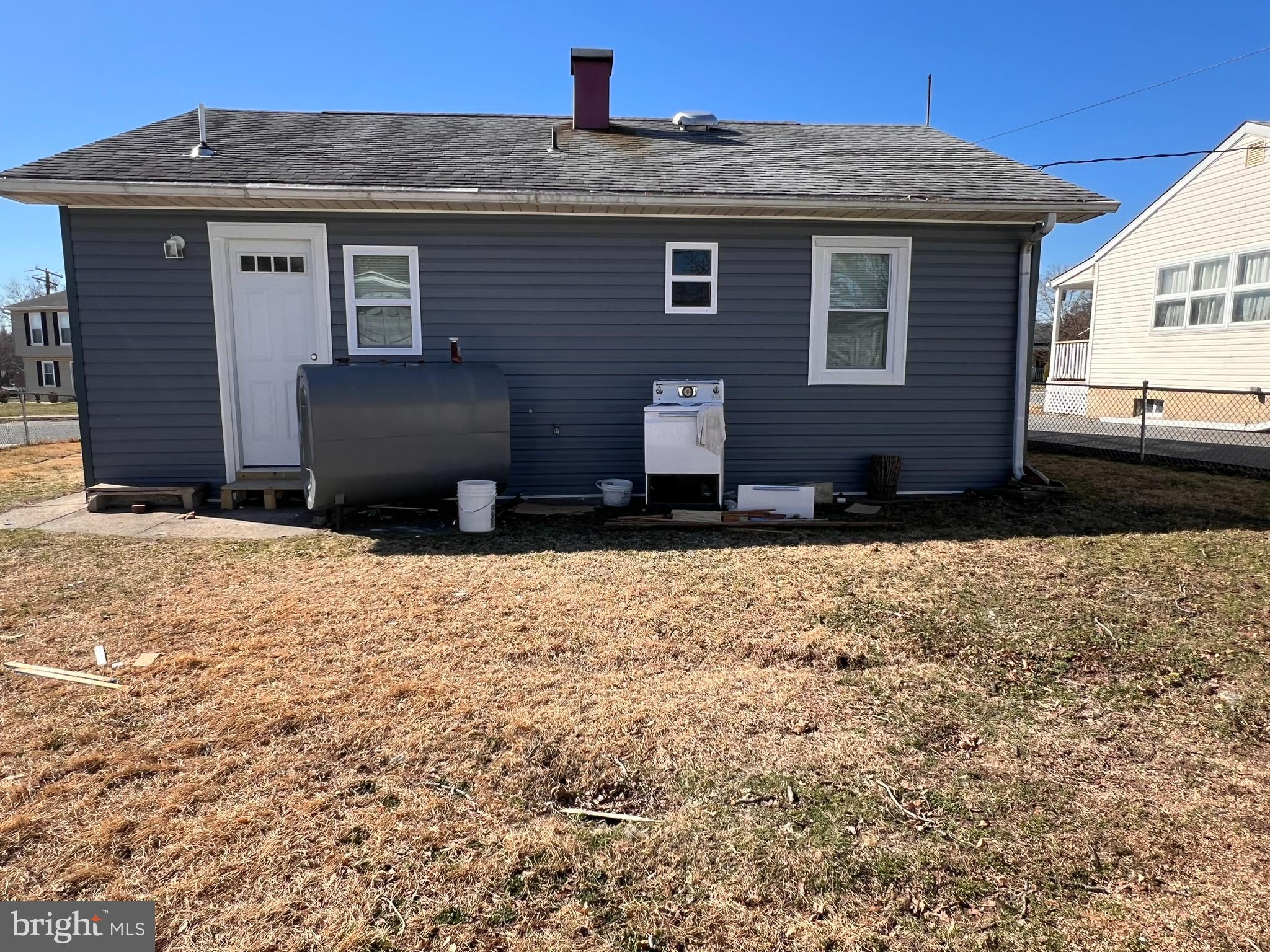1325 Fuselage Avenue Baltimore, MD 21220 - Photo 9 of 10 a front view of a house with a yard