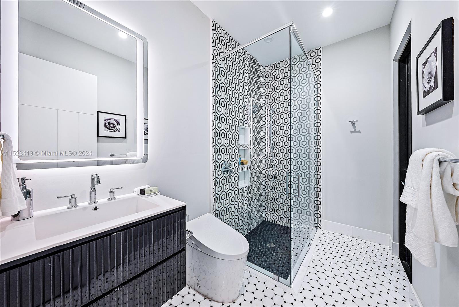 364 Northeast 6th Street Boca Raton, FL 33432 - Photo 24 of 80 a bathroom with a sink a toilet and shower