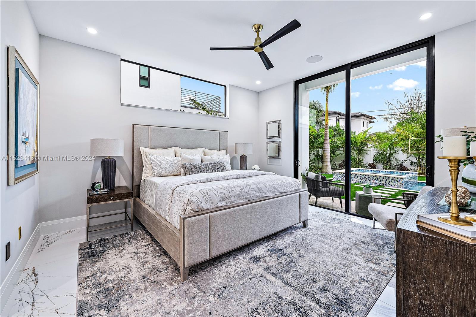 364 Northeast 6th Street Boca Raton, FL 33432 - Photo 25 of 80 a bed sitting in a spacious bedroom next to a window